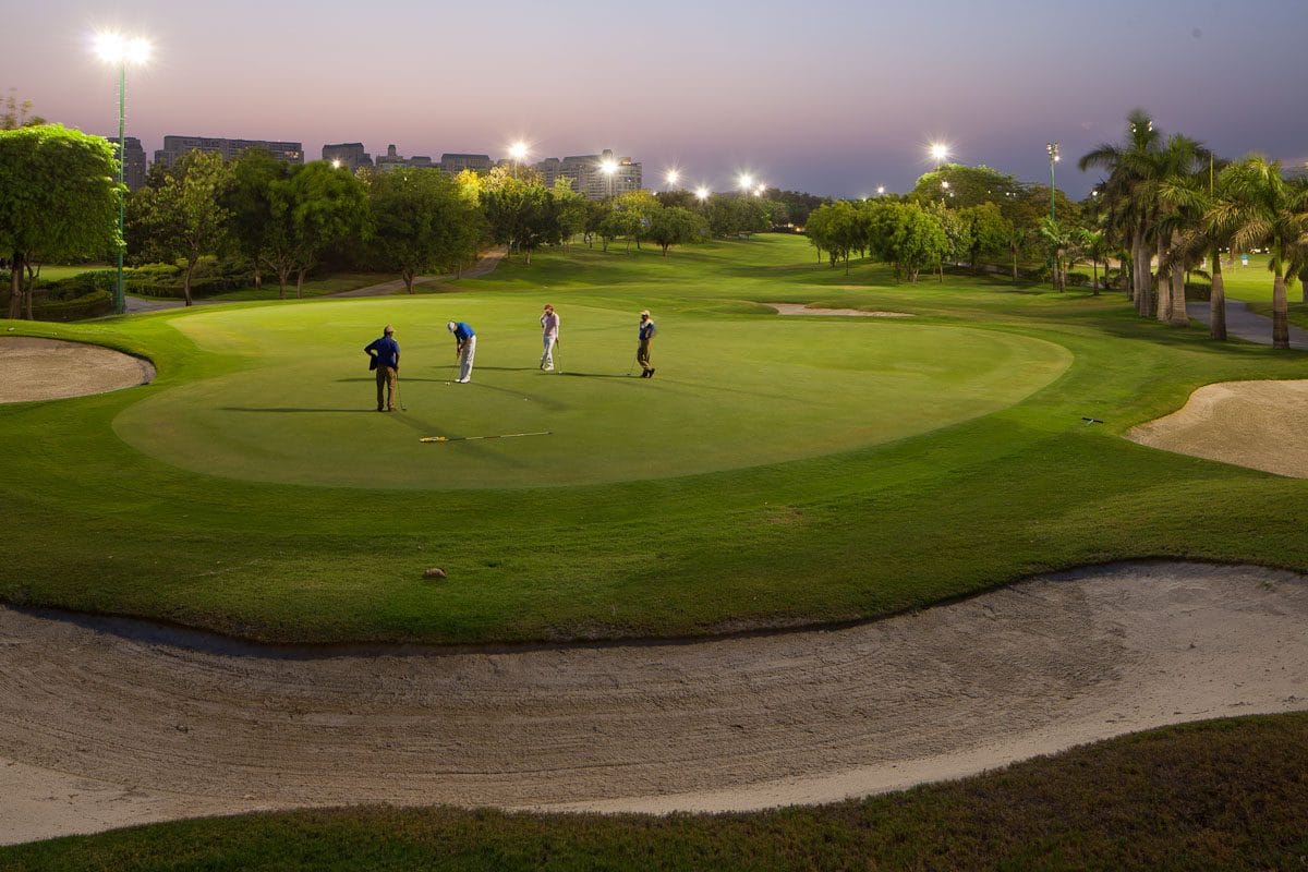 A golf course laid against a dramatic landscape